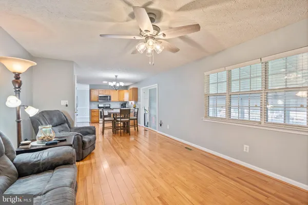 a living room with furniture and garden view
