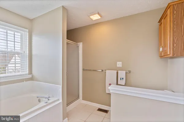 a white bath tub sitting next to a window