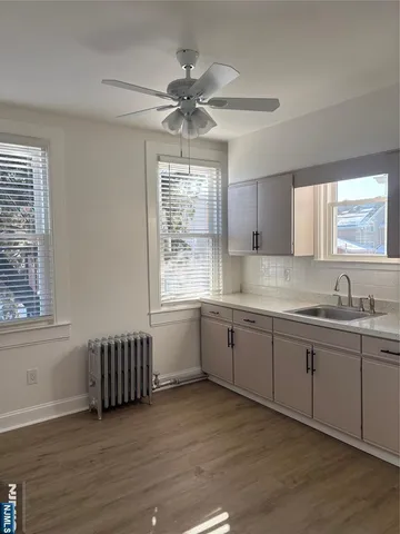 a kitchen with sink cabinets and window