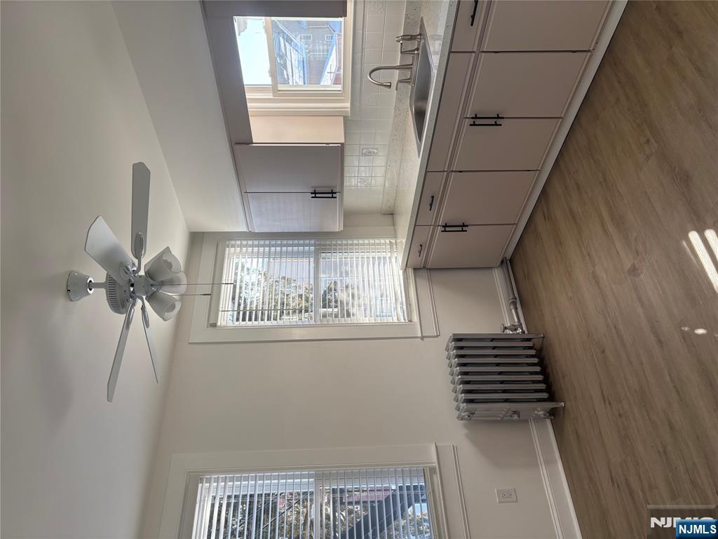 761 Hamilton Street, Unit 2 Harrison, NJ 07029 - Photo 2 of 14 a kitchen with sink cabinets and window