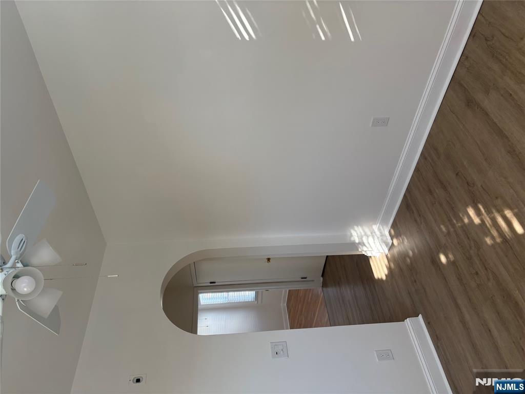 761 Hamilton Street, Unit 2 Harrison, NJ 07029 - Photo 4 of 14 wooden floor in an empty room