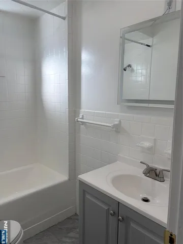 a bathroom with a sink and a bathtub