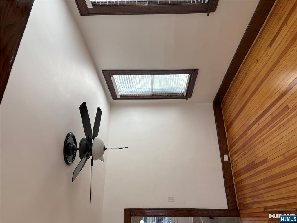 761 Hamilton Street, Unit 2 Harrison, NJ 07029 - Photo 7 of 14 a view of an empty room with wooden floor and a window