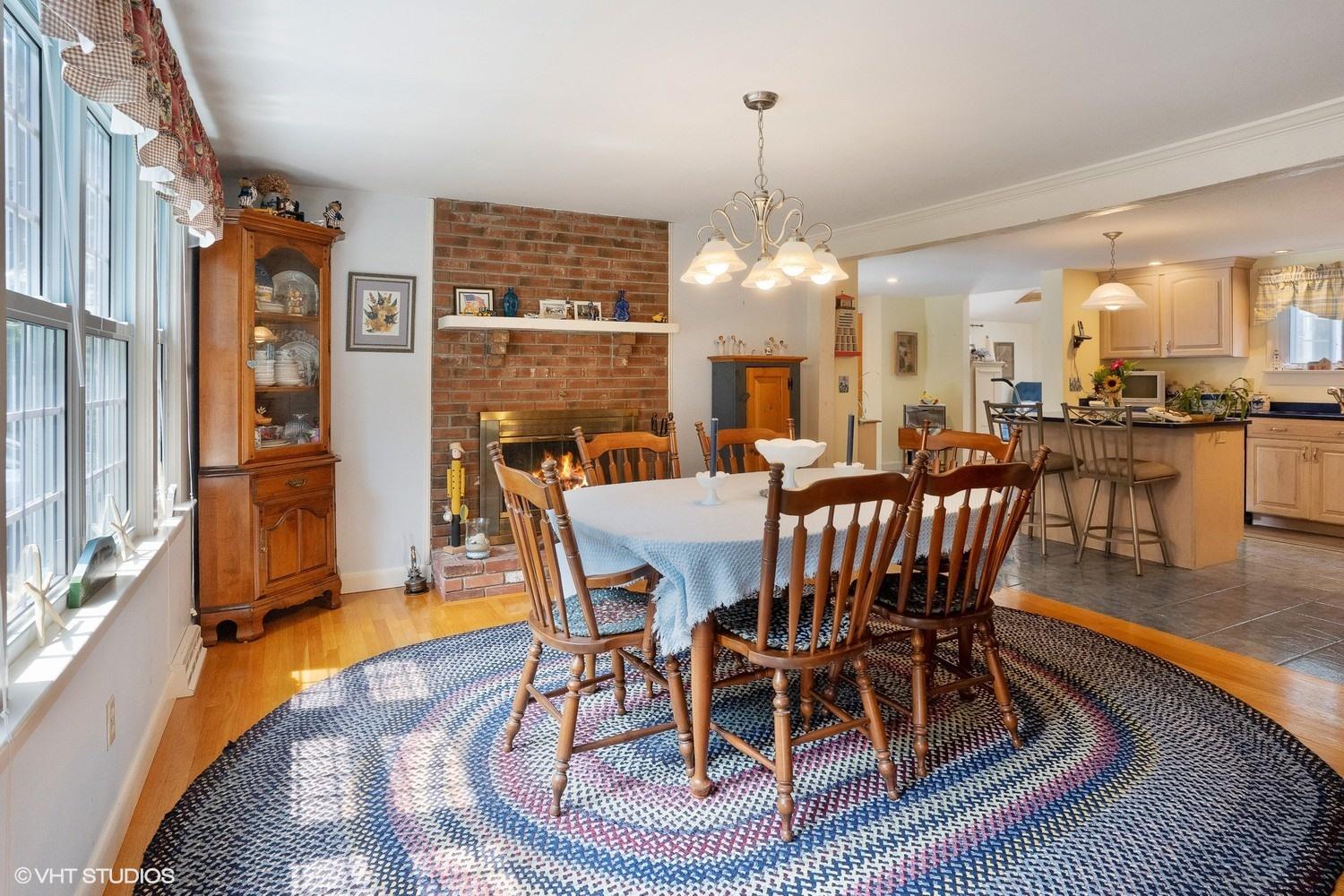 45 Eileen Road Chatham, MA 02633 - Photo 4 of 18 a dining room with furniture a chandelier and wooden floor