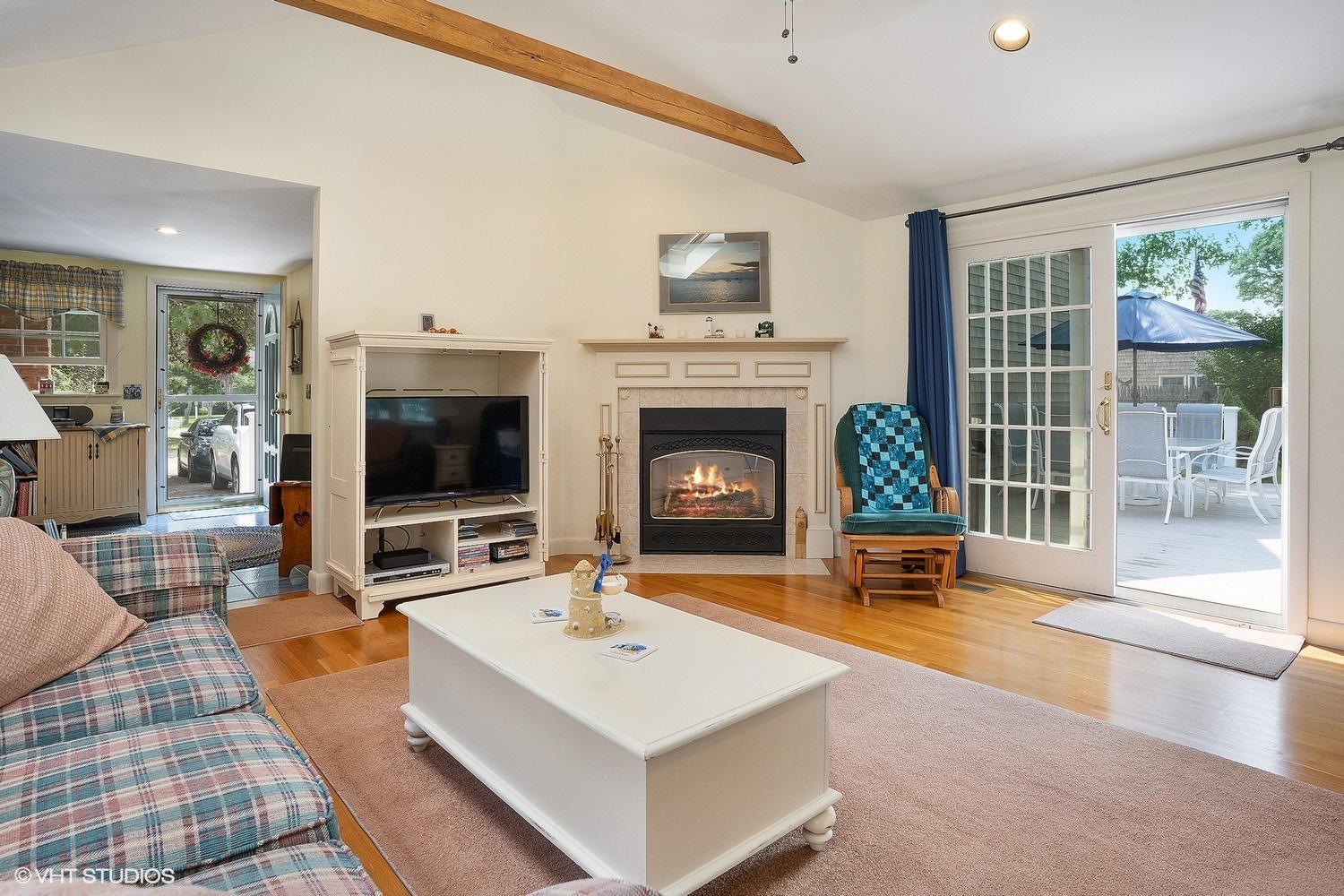 45 Eileen Road Chatham, MA 02633 - Photo 7 of 18 a living room with furniture and a fireplace