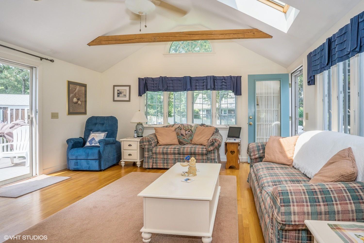 45 Eileen Road Chatham, MA 02633 - Photo 8 of 18 a living room with furniture and a large window