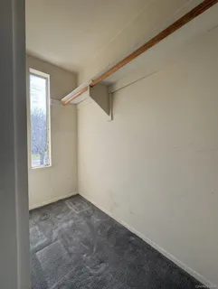 a view of room with window and closet