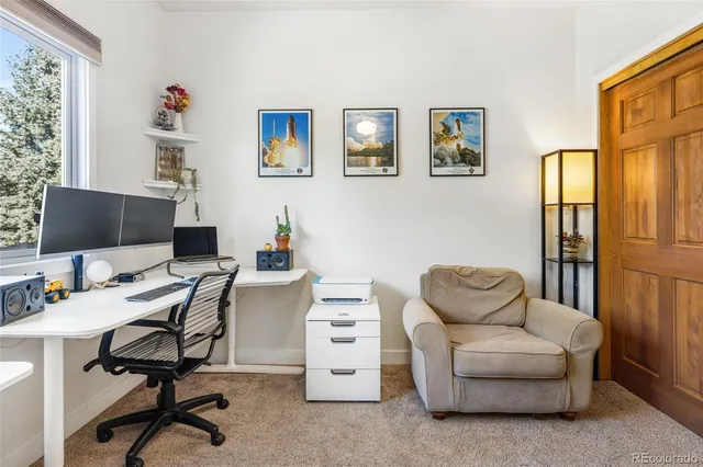 a workspace with furniture and a window