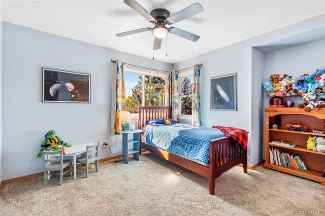 a bed room with a bed and a chandelier