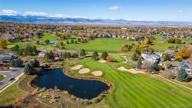 an aerial view of a house with a big yard