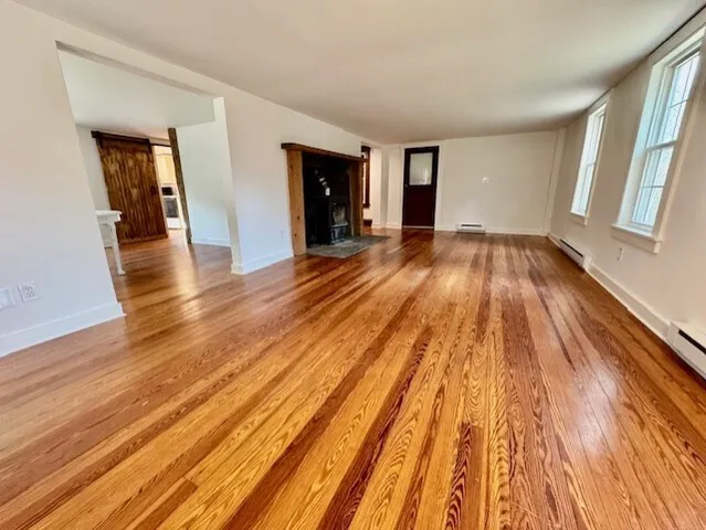 wooden floor in a hall with an entryway