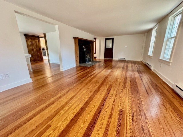 567 Firetown Road Simsbury, CT 06070 - Photo 11 of 39 wooden floor in a hall with an entryway