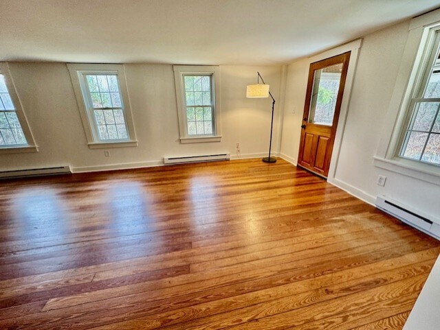 567 Firetown Road Simsbury, CT 06070 - Photo 13 of 39 a view of an empty room with wooden floor and a window