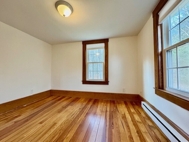 567 Firetown Road Simsbury, CT 06070 - Photo 18 of 39 a view of an empty room with wooden floor and a window