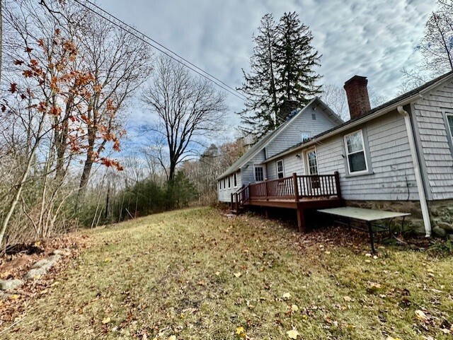 567 Firetown Road Simsbury, CT 06070 - Photo 34 of 39 a house view with a backyard space