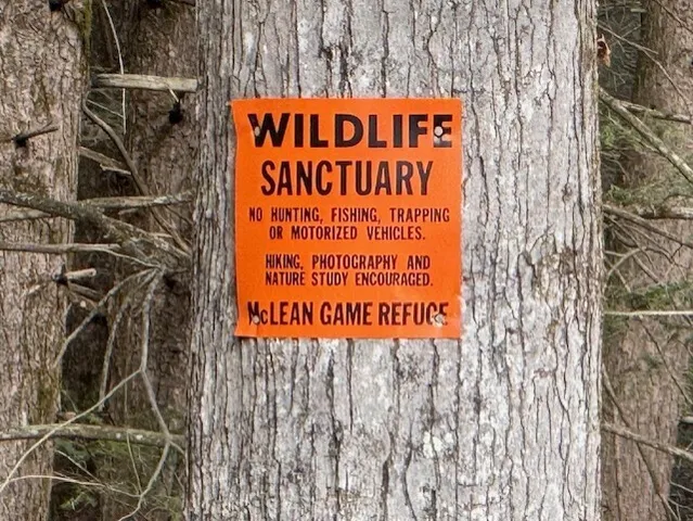 a sign on the wall of building