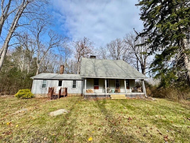 567 Firetown Road Simsbury, CT 06070 - Photo 39 of 39 a front view of a building with a garden and trees