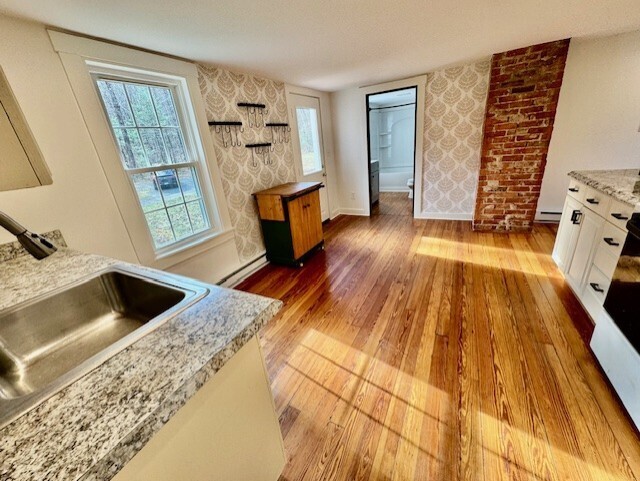 567 Firetown Road Simsbury, CT 06070 - Photo 6 of 39 a view of kitchen and wooden floor