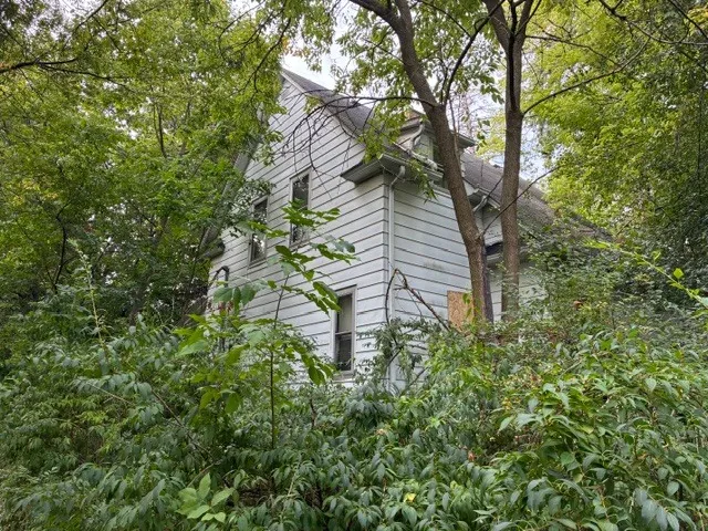 a backyard of a house with lots of green space