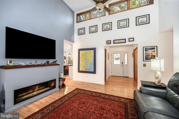 a kitchen with stainless steel appliances a dining table chairs stove and refrigerator