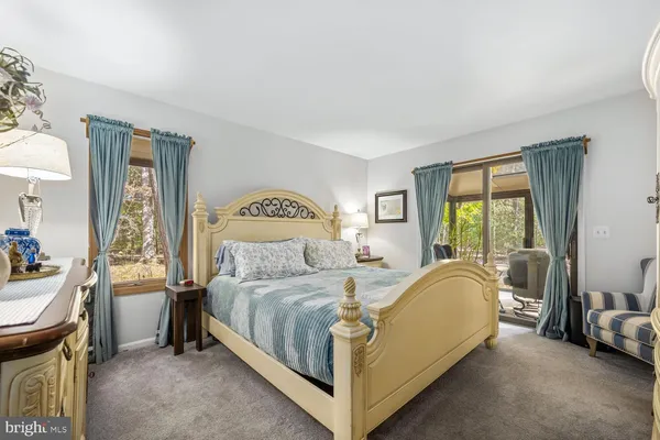 a bathroom with a shower sink and mirror