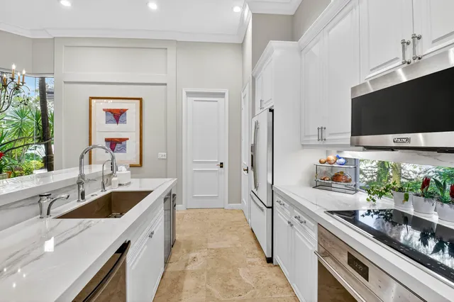 a bathroom with a granite countertop sink a toilet and a mirror
