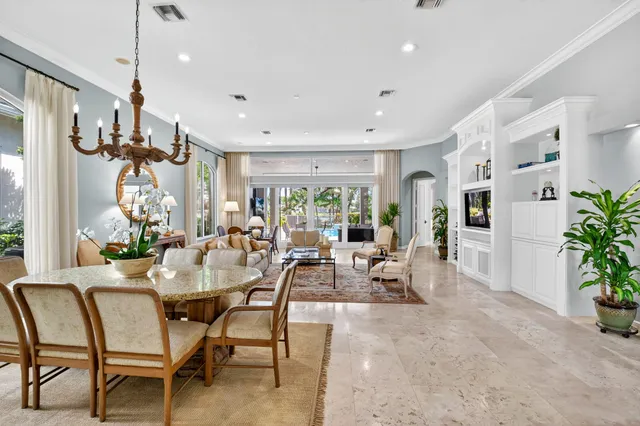 a bedroom with a bed and a flat tv screen on dresser