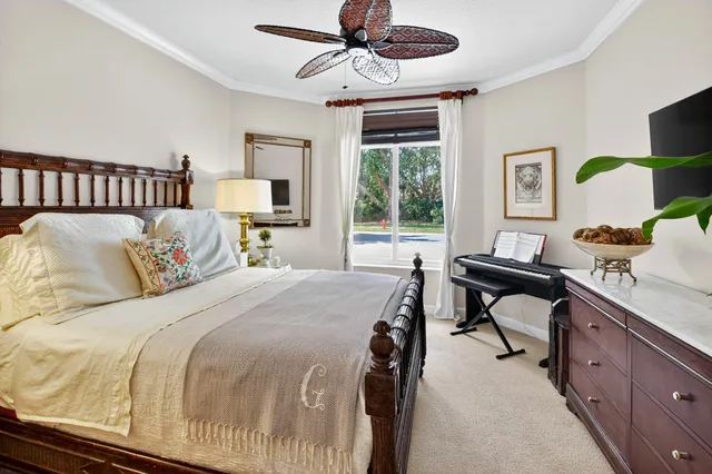 an aerial view of residential houses with outdoor space and swimming pool