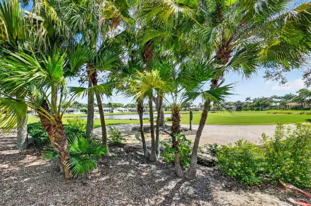 a living room with furniture and a lamp