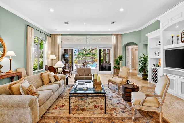 a living room with furniture wooden floor and a flat screen tv