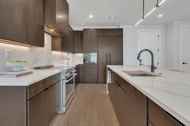 a bedroom with a large bed and a couch