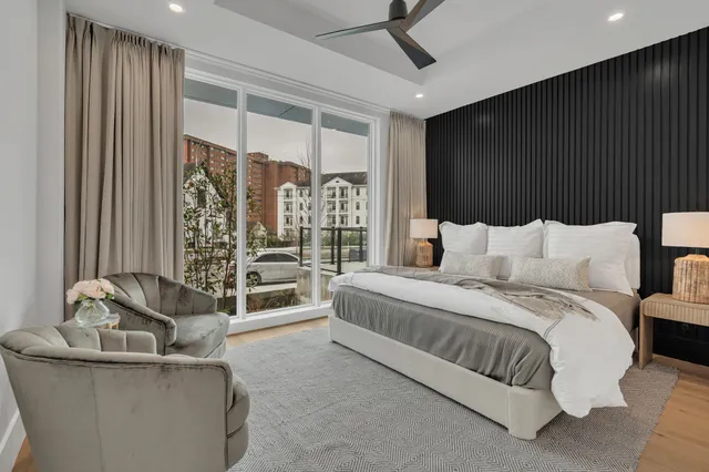 a bedroom with bed and a couch