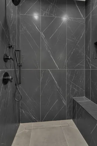 an empty room with wooden floor and closet