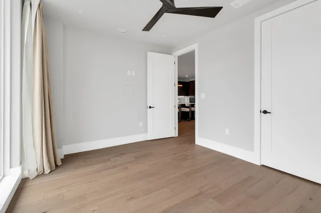 a bathroom with a bathtub sink mirror and toilet