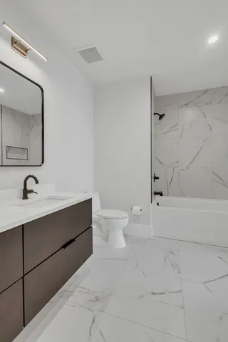 a living room with furniture and white walls