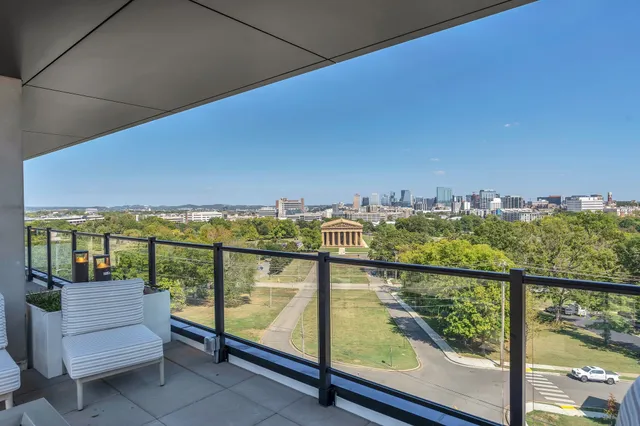 a kitchen with stove and cabinets
