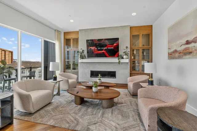 a view of balcony with two chairs and a potted plant