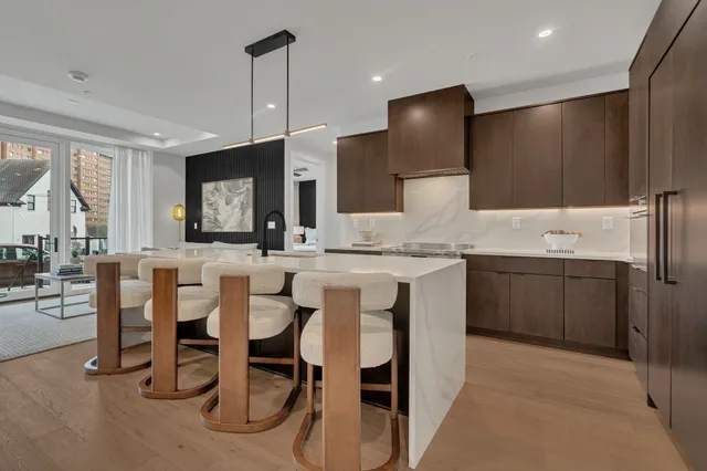 a kitchen with a sink cabinets and window