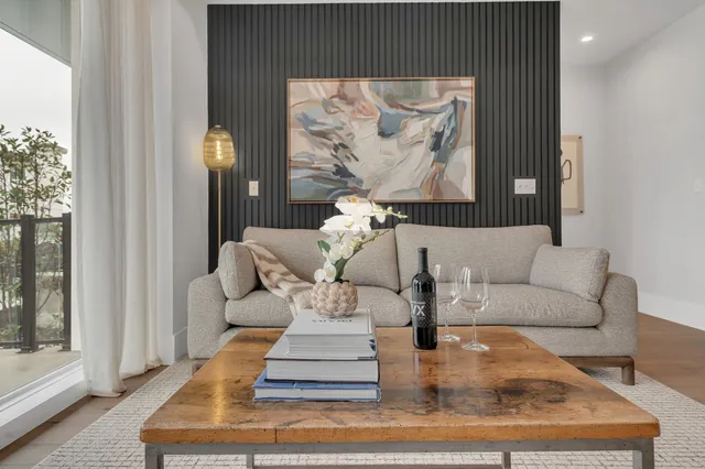 a view of fireplace with furniture and wooden floor