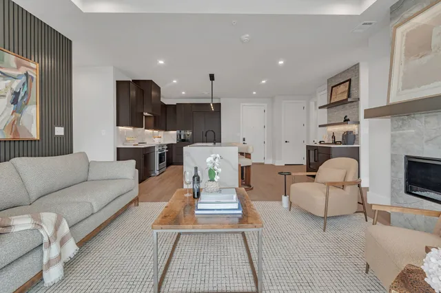 a living room with furniture and a fireplace