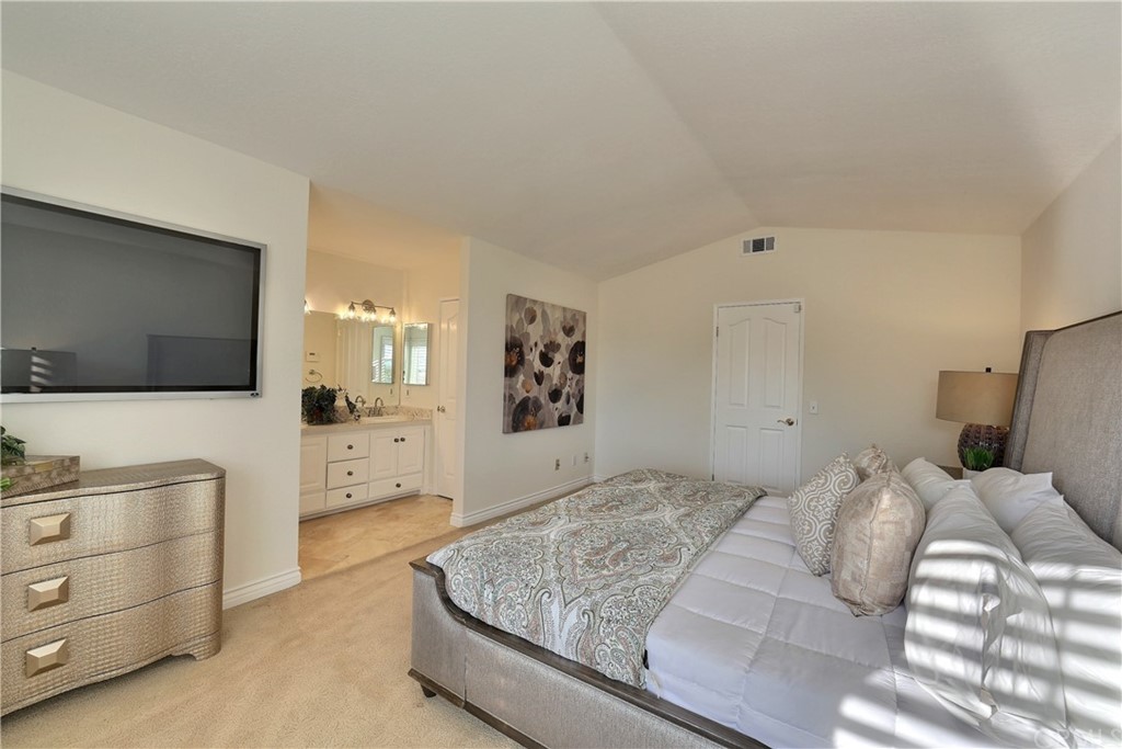 19271 Kamlyn Lane Walnut, CA 91789 - Photo 17 of 29 a bedroom with a bed and a flat screen tv