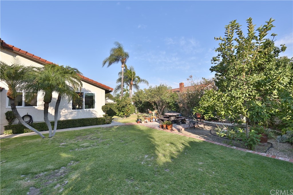 19271 Kamlyn Lane Walnut, CA 91789 - Photo 27 of 29 a view of a backyard with table and chairs and a slide