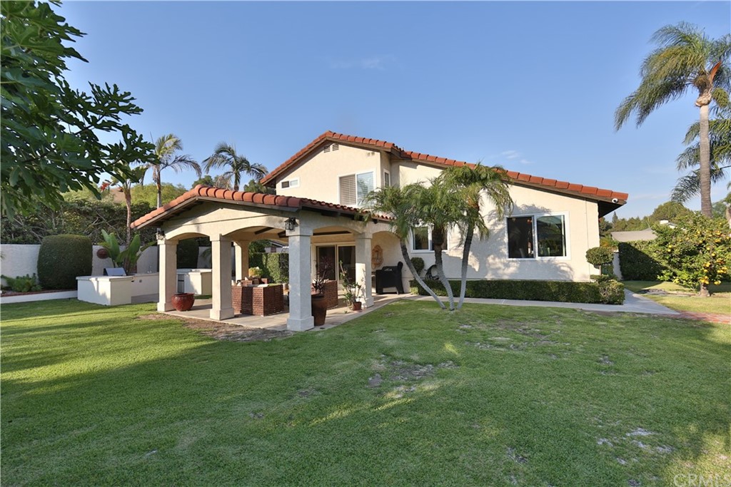 19271 Kamlyn Lane Walnut, CA 91789 - Photo 28 of 29 a front view of a house with a garden and trees