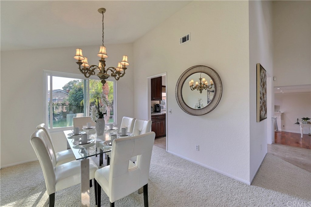 19271 Kamlyn Lane Walnut, CA 91789 - Photo 7 of 29 a view of a dining room with furniture a chandelier and wooden floor