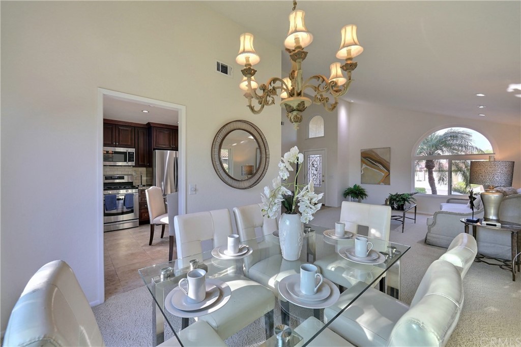 19271 Kamlyn Lane Walnut, CA 91789 - Photo 8 of 29 a view of a dining room with furniture a chandelier and wooden floor