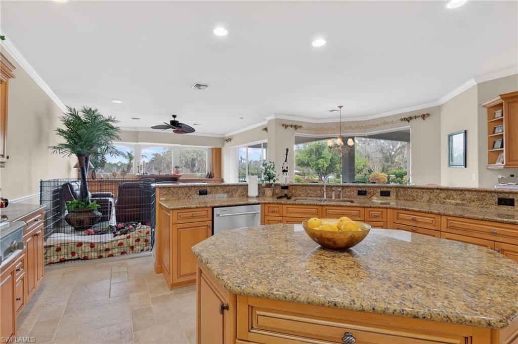 1964 Rialto Way Alva, FL 33920 - Photo 15 of 50 a kitchen with kitchen island granite countertop lots of counter top space and living room