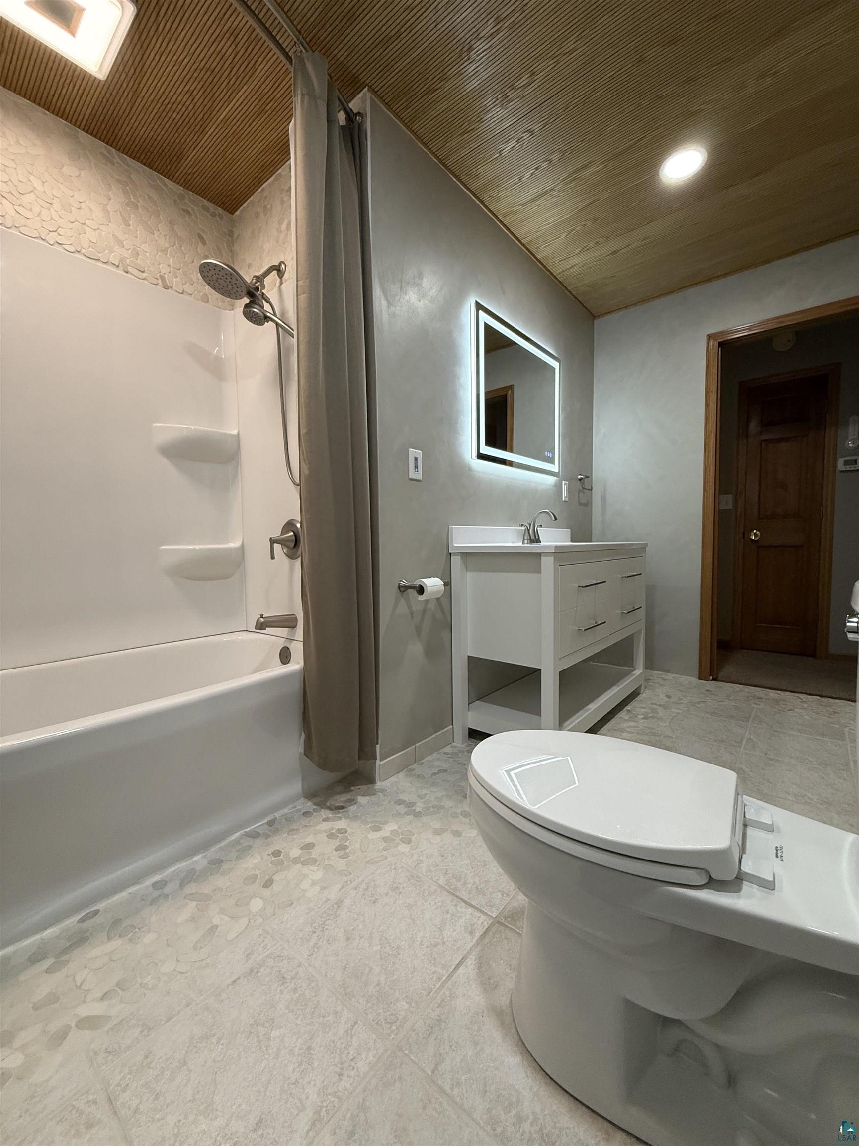 1321 South 13th Street Virginia, MN 55792 - Photo 14 of 33 Bathroom featuring vanity, shower / tub combo, light tile patterned flooring, and wood ceiling