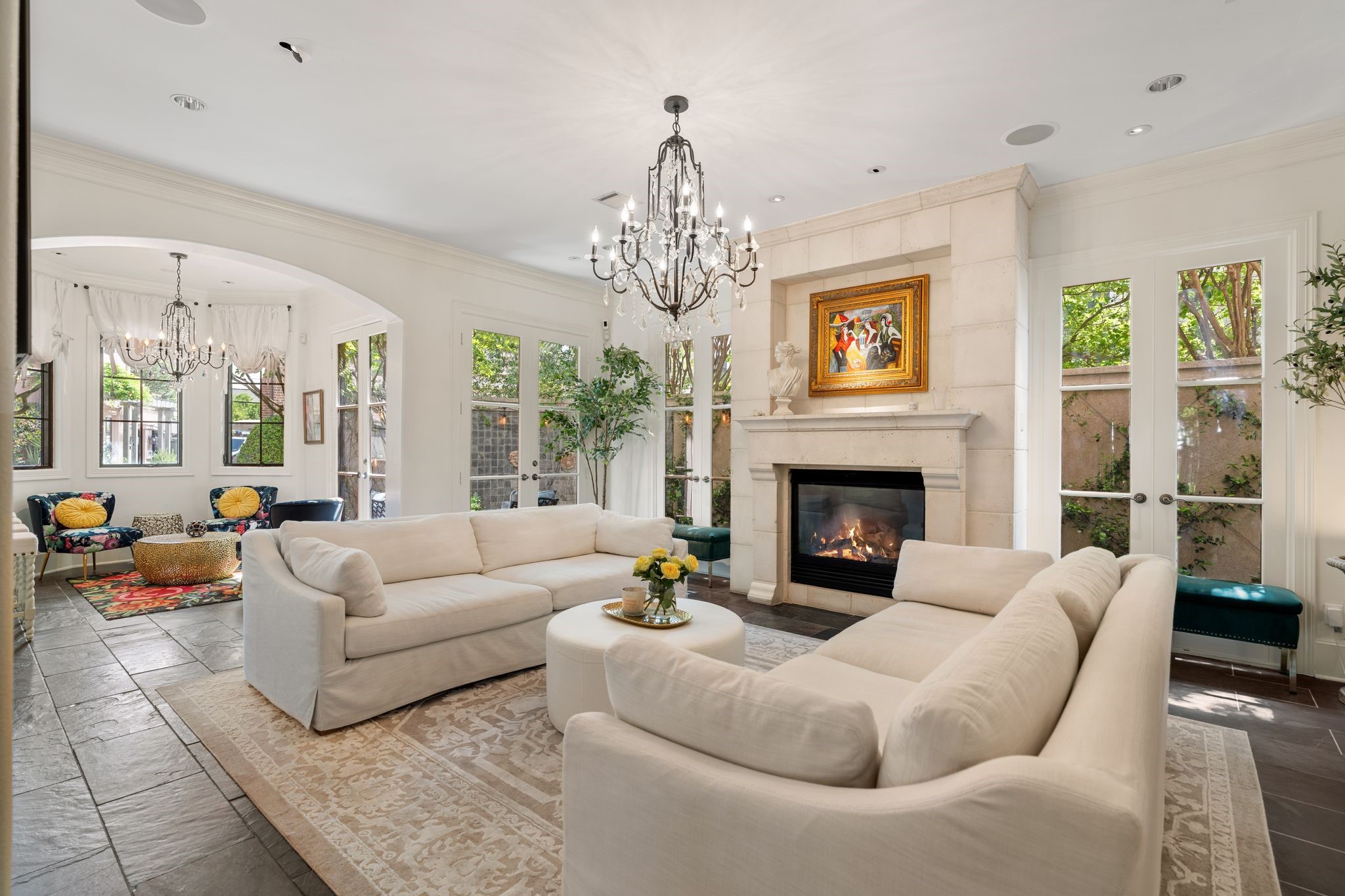 30 Hackberry Lane, Unit A Houston, TX 77027 - Photo 13 of 42 Light-filled family room flows seamlessly into the adjacent breakfast room, thoughtfully staged as a secondary seating area—ideal for casual gatherings or morning relaxation.