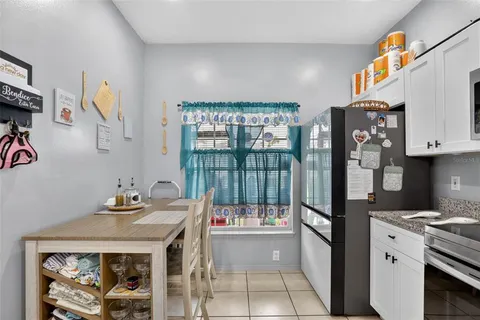 a kitchen with stainless steel appliances a stove a refrigerator and a sink