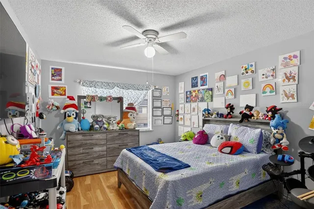 a bed room with a bed and a desk